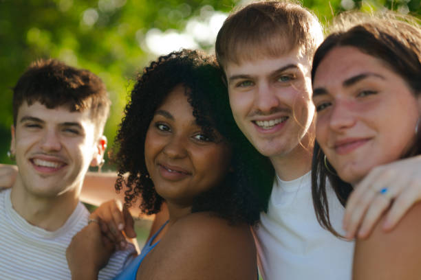 istock Happy multi-ethnic friends embracing togetherness in nature 2184073092