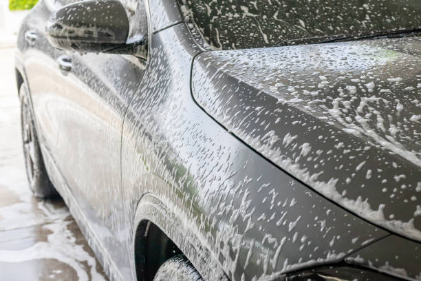 istock car cleaning and washing with foam soap 2184073380