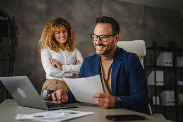 istock two colleagues work together and review contract in the office 2184073626