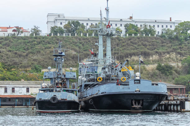 istock Ships are in port at anchor. Background barracks and gray sky 2184073769