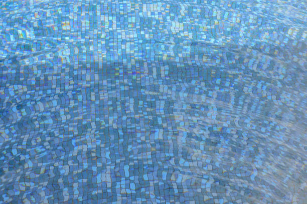 Swimming pool water surface and ripple wave with blue mosaic tiles