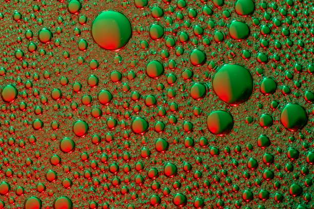 istock Cells floating in a background of green 2184074383