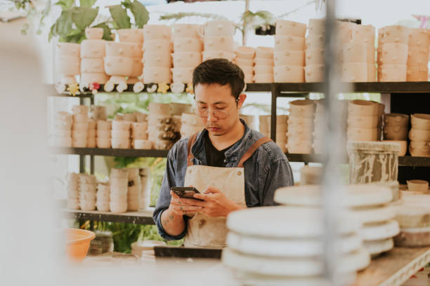 istock Asian potter is doing an online business at studio. 2184076034