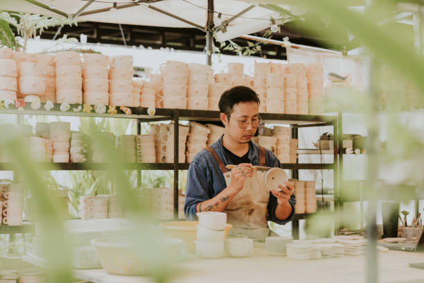istock Asian potter is working on his pottery. 2184076047