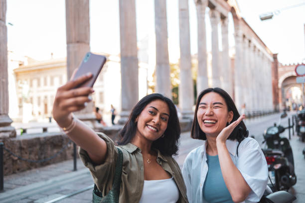 istock Two friends taking a selfie in Milan, Italy 2184076439