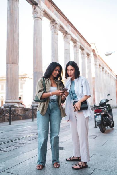 istock Two friends visiting historical site in Milan, Italy 2184076440
