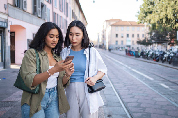 Two friends exploring Milano city streets together