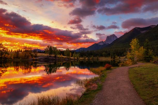 istock Cloudy Sunrise Glowing Over Quarry Lake In Canmore 2184077015