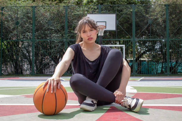istock Young woman modeling with a basketball 2184079678