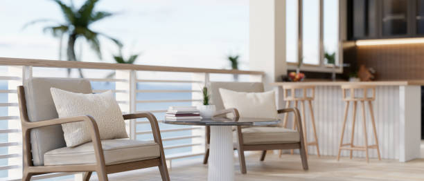 istock A contemporary lounge or a cafe features a comfortable seat by the railing with a beautiful sea view 2184085519