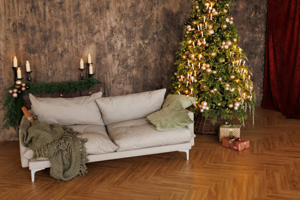 istock A cozy living room with a grey couch and a Christmas tree 2184088517