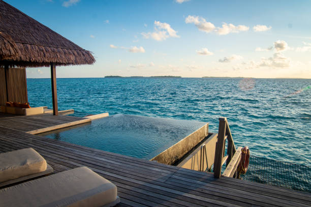istock Sunset views from overwater pool villa in Maldives 2184092801