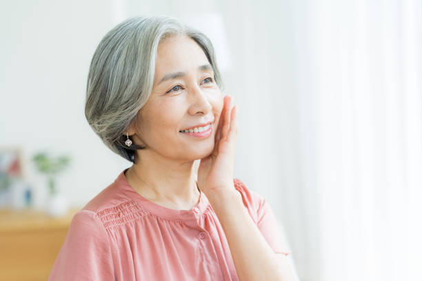 istock Senior woman doing skin care 2184093494