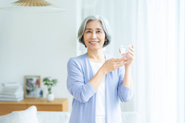 istock senior woman holding a cup 2184093874