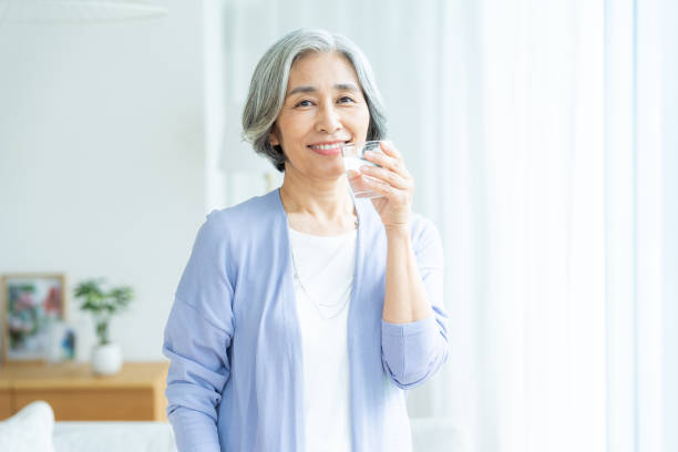 istock senior woman holding a cup 2184093877