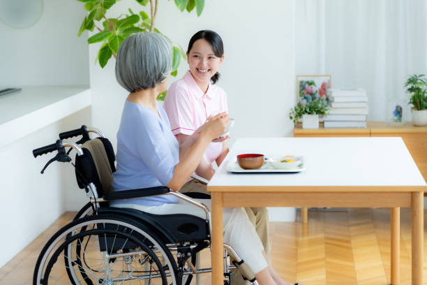 istock Caregiver preparing meals 2184093998