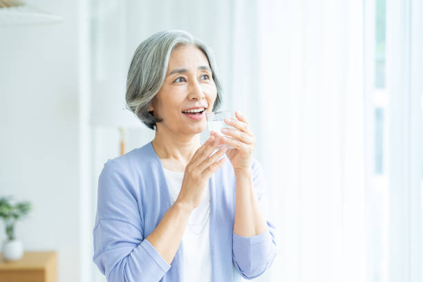 istock senior woman holding a cup 2184094083