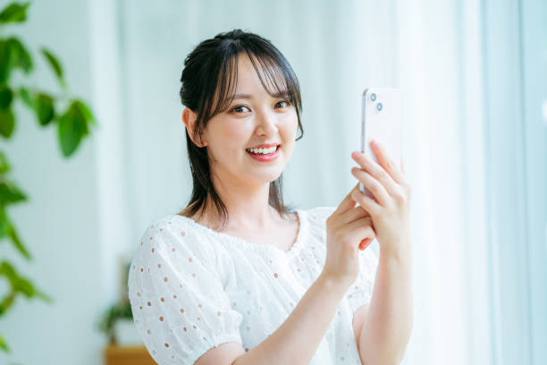 istock young woman calling on smartphone 2184094456