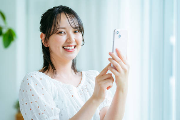 istock young woman calling on smartphone 2184094457