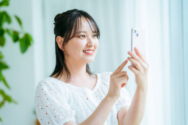 istock young woman calling on smartphone 2184094458