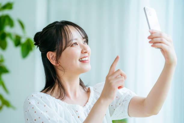 istock young woman calling on smartphone 2184094461