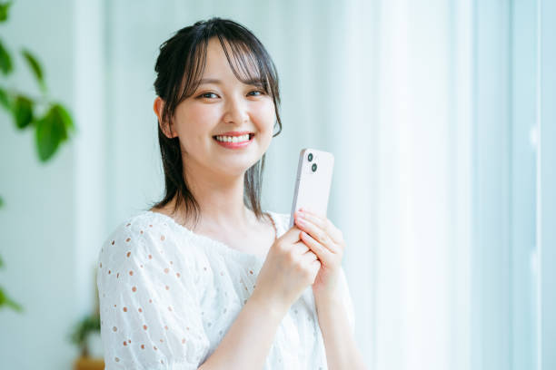 istock young woman calling on smartphone 2184094467