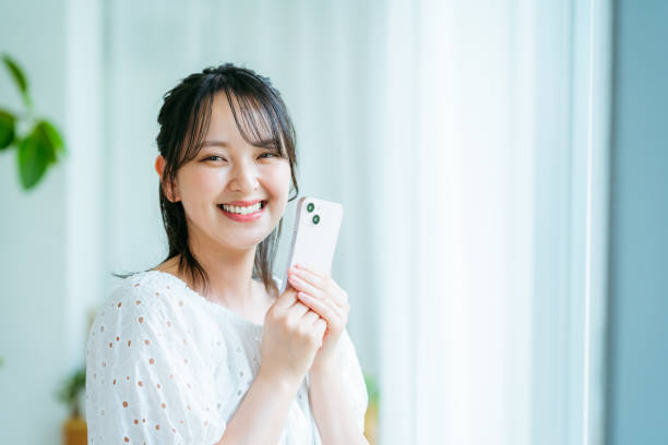 istock young woman calling on smartphone 2184094477