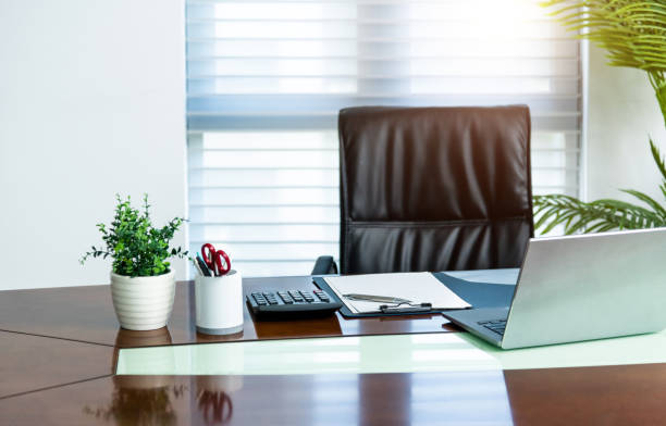 istock Laptop and office supply on the office desk 2184098467