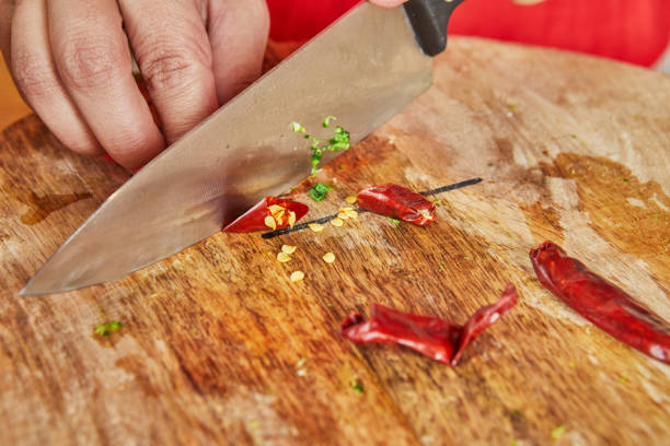 Sliced ​​chili on a wooden chopping board