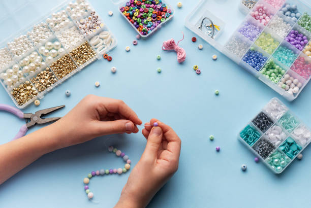 istock Creating colorful beaded jewelry with vibrant materials on a crafting table 2184099888