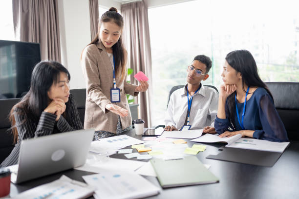 istock Business asian Multicultural businesspeople working project  working together in office conference ideas in startup at office Diversity leadership and business people 2184101379