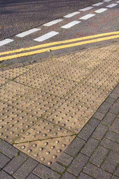 istock Tactile paving and road markings on an urban sidewalk. 2184103665