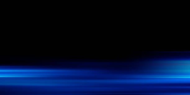 istock Moving fast laser beams of light isolated on black background. Abstract speed light effects. Lens flare. Horizontal rays glowing in the dark 2184104102