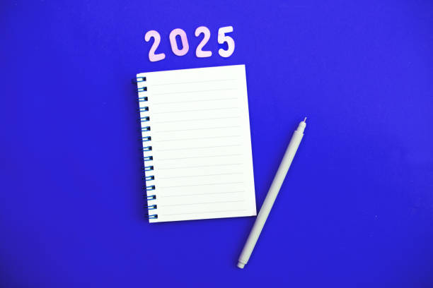 istock Top view of white paper blank notebook for writing wish list. 2184104385