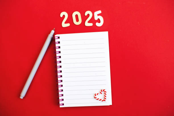 istock Top view of white paper blank notebook for writing wish list. 2184104392