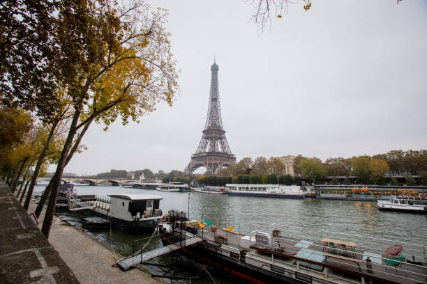 Boats moored on the banks of the River Seine by the Eiffel Tower