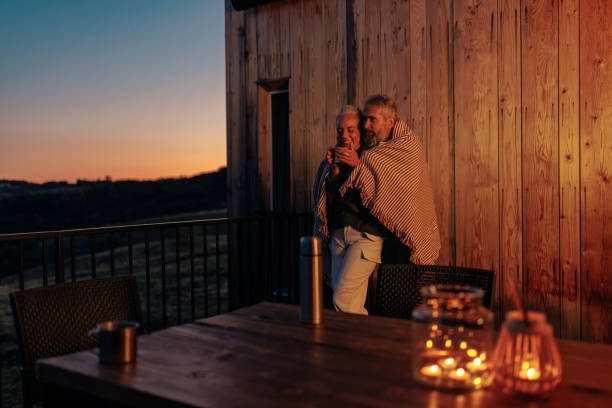 istock Mature couple enjoy evening outdoors. 2184106286