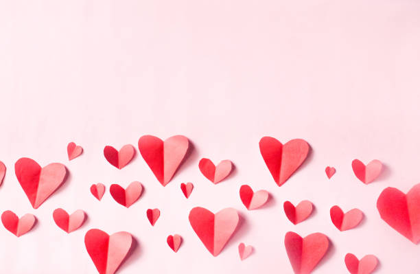 istock red hearts pattern with negative space on pink background. Valentine's day background. 2184106680