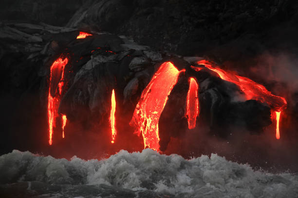 istock Red hot lava flowing into Pacific Ocean on Big Island, Hawaii 2184108889