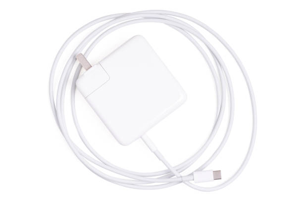 istock Top view Charger cord and plug for gadget on white. 2184110507