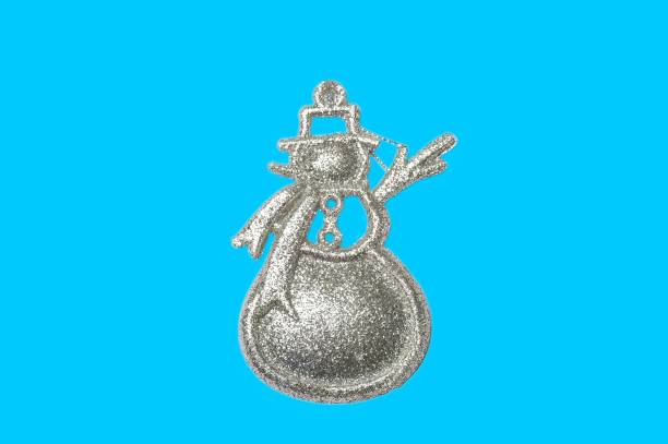 Shiny Snowman Decoration isolated on blue background. snowy weather 20