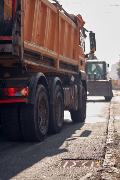 istock Heavy construction machines and truck outdoors for public street reconstruction. 2184111497