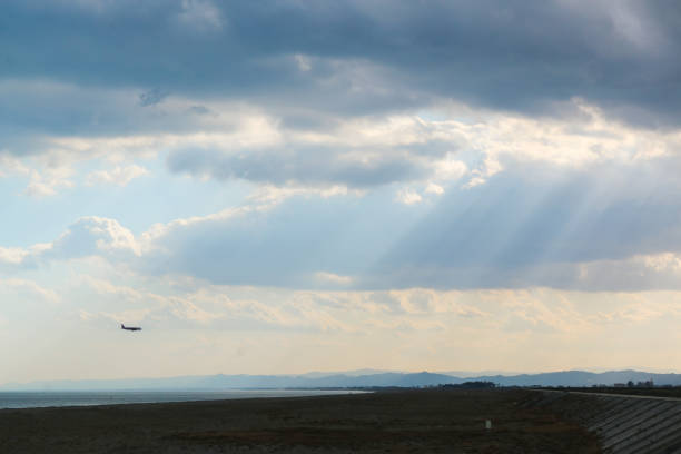 Coastal scene with a plane about to land