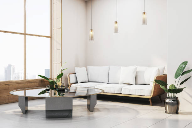 istock Modern living room interior with white sofa, glass coffee table, and large window overlooking the cityscape in a cozy setting. 3D Rendering 2184114068