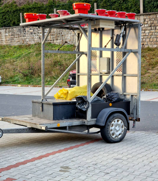 istock an arrow with a commanding direction of travel on a trolley behind a passenger car is suitable for marking work in lanes on the highway. a broken down vehicle constitutes a dangerous obstacle, men 2184114370