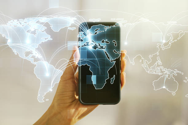 istock Abstract graphic digital world map with connections and hand with mobile phone on background, globalization concept. Multiexposure 2184114543