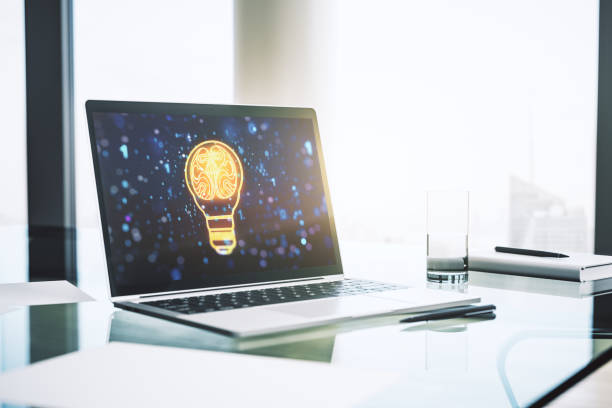 istock Modern computer monitor with creative light bulb hologram with human brain, idea and brainstorming concept. 3D Rendering 2184114591
