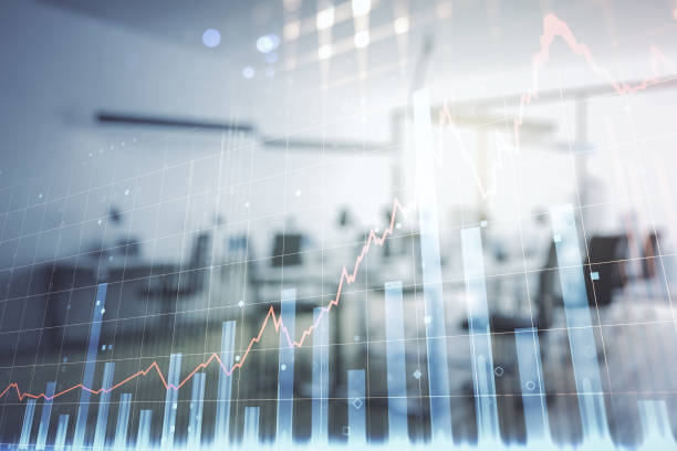 istock Abstract virtual financial graph hologram on a modern furnished classroom background, financial and trading concept. Multiexposure 2184114614