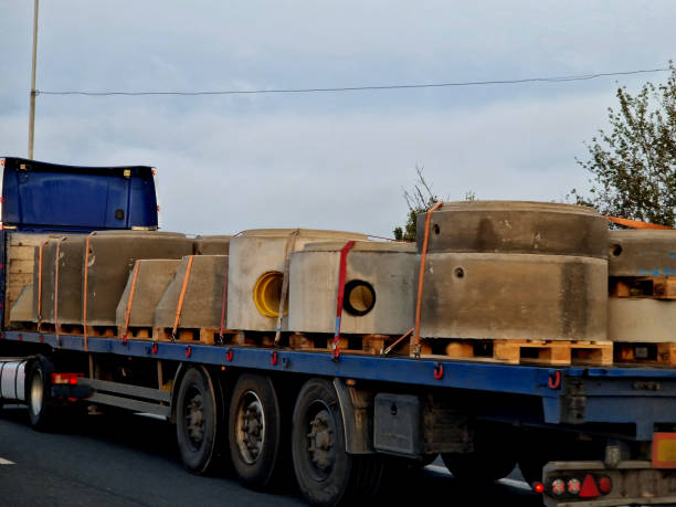 istock transport of sewage rings on an open semi-trailer. everything is pulled down with straps. overloaded trucks are weighed by the police 2184116252