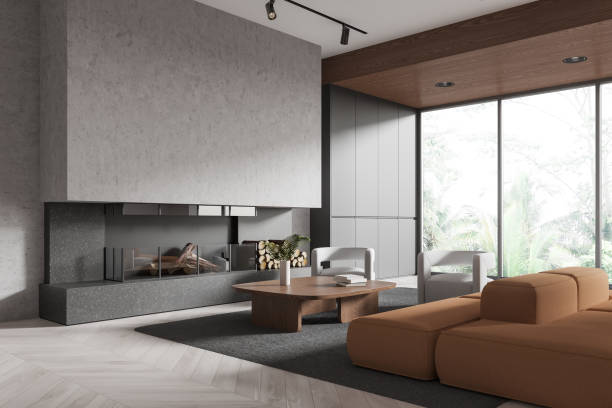 istock Home interior with sofa and armchairs, coffee table and fireplace near window 2184117178